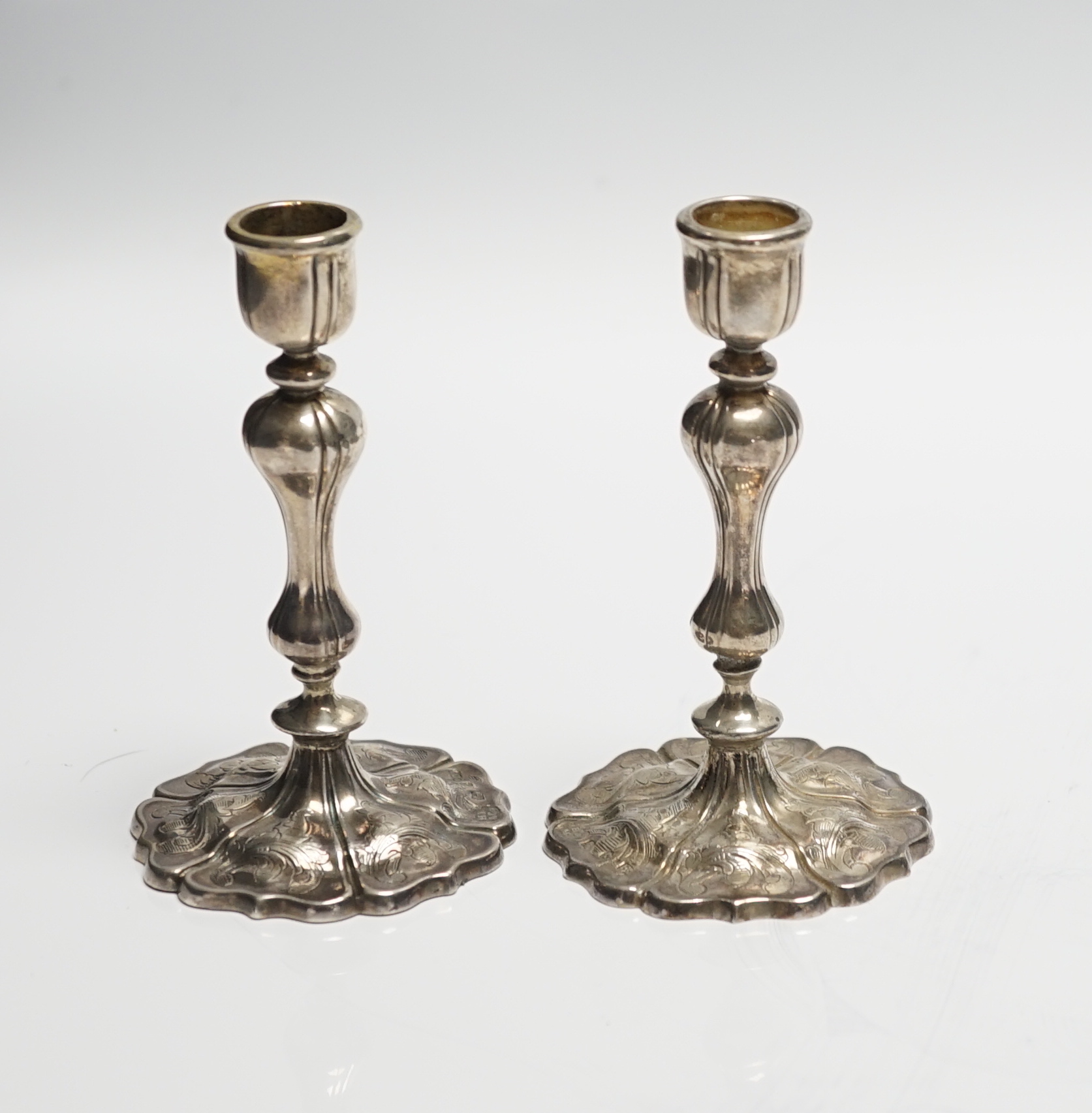 A pair of Victorian engraved silver taper sticks, by Hawksworth, Eyre & Co, Sheffield, 1848, 10.7cm, 97 grams.